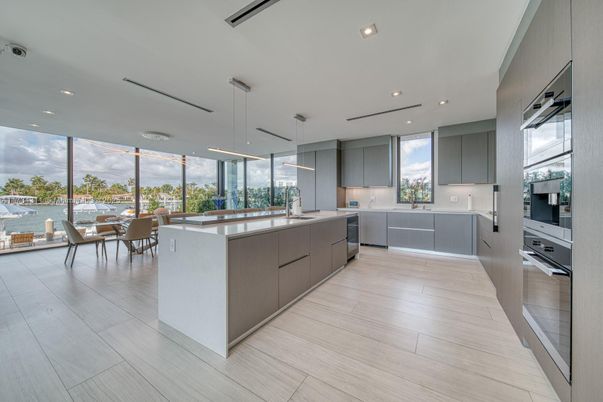 Dining room, Interior, Kitchen, Pendant Lights, Recessed Lighting, Stainless Steel Appliances, Water, Wood Texture Flooring