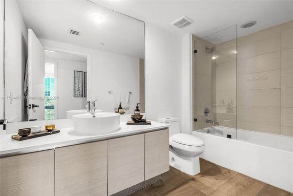 Bathroom, Dual Sink Vanities, Glass Shower, Interior, Recessed Lighting, Wood Texture Flooring
