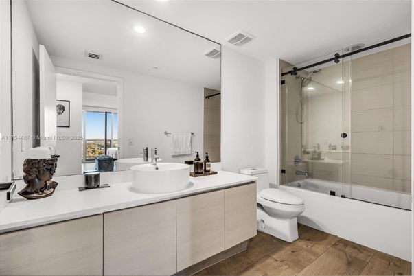 Bathroom, Dual Sink Vanities, Glass Shower, Interior, Recessed Lighting, Wood Texture Flooring