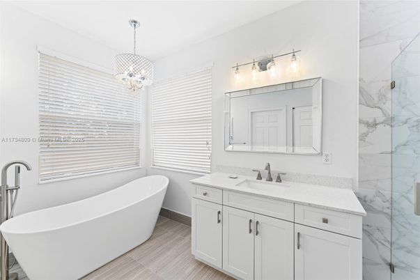 Bathroom, Dual Sink Vanities, Free Standing Baths, Interior, Marble, Marble Walls, Pendant Lights