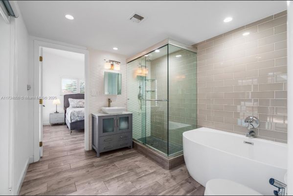 Bathroom, Bedroom, Free Standing Baths, Glass Shower, Interior, Recessed Lighting, Wood Texture Flooring