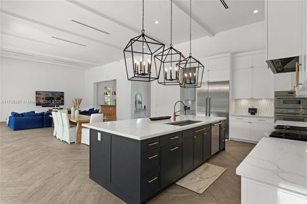 Chandelier, Interior, Kitchen, Living room, Pendant Lights, Recessed Lighting, Stainless Steel Appliances, Wood Texture Flooring
