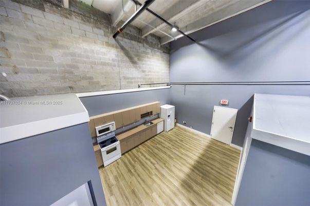 Interior, Kitchen, Stainless Steel Appliances, Stone Walls, Wood Texture Flooring