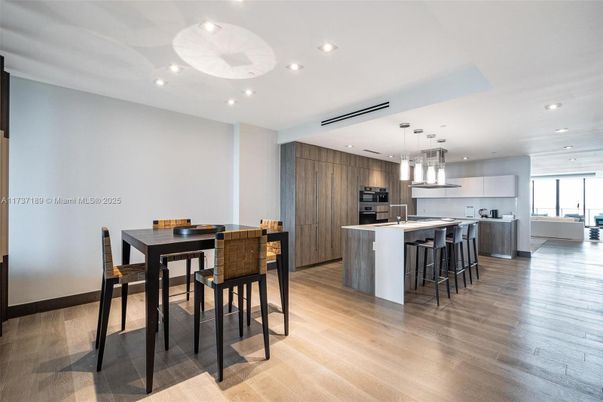 Dining room, Interior, Kitchen, Pendant Lights, Recessed Lighting, Stainless Steel Appliances, Wood Texture Flooring