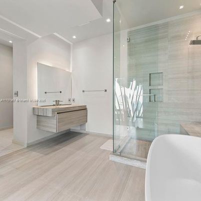 Bathroom, Free Standing Baths, Glass Shower, Interior, Recessed Lighting, Wood Texture Flooring