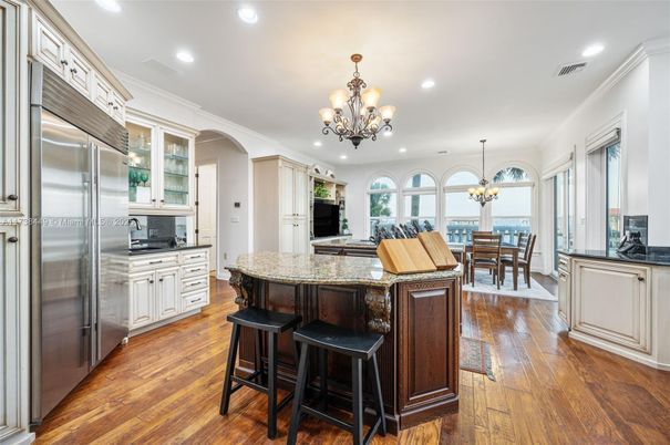 Chandelier, Dining room, Interior, Kitchen, Recessed Lighting, Stainless Steel Appliances, Wood Texture Flooring