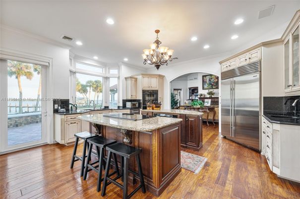Chandelier, Interior, Kitchen, Recessed Lighting, Stainless Steel Appliances, Wood Texture Flooring