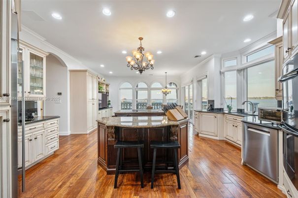 Chandelier, Dining room, Interior, Kitchen, Recessed Lighting, Stainless Steel Appliances, Wood Texture Flooring