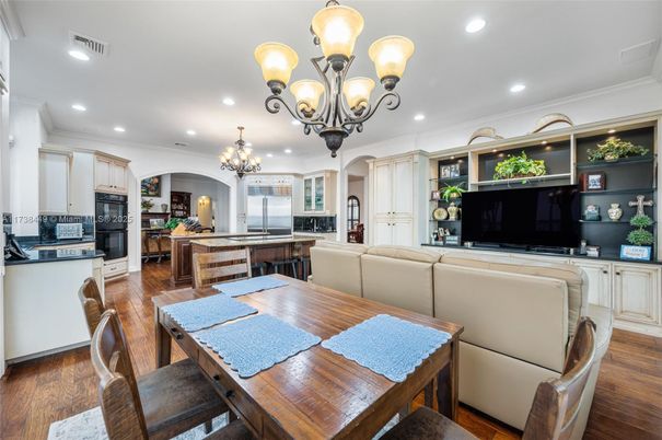Chandelier, Dining room, Interior, Kitchen, Living room, Recessed Lighting, Stainless Steel Appliances, Wood Texture Flooring