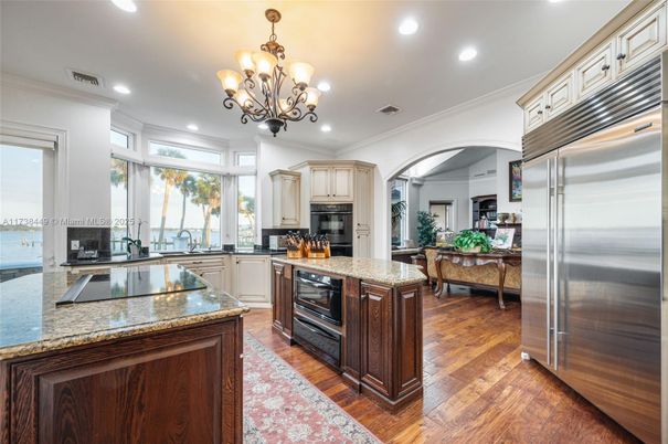 Chandelier, Interior, Kitchen, Living room, Recessed Lighting, Stainless Steel Appliances, Wood Texture Flooring