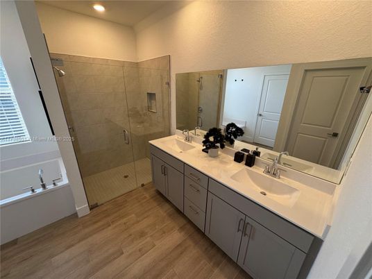Bathroom, Dual Sink Vanities, Glass Shower, Interior, Recessed Lighting, Wood Texture Flooring