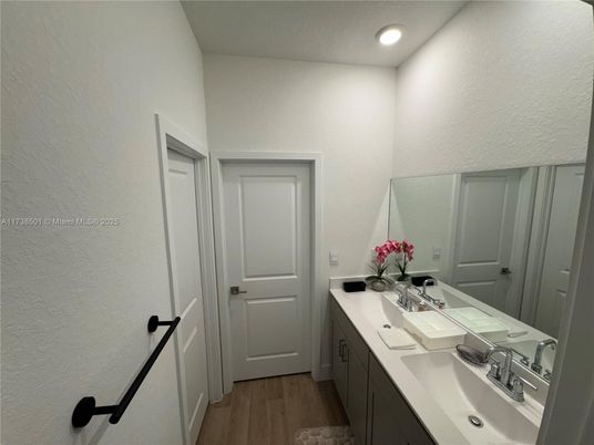 Bathroom, Dual Sink Vanities, Interior, Recessed Lighting, Wood Texture Flooring