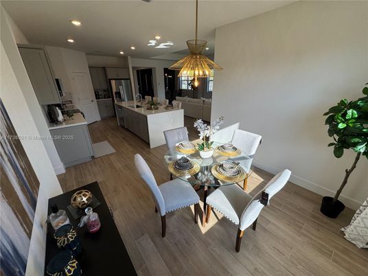 Dining room, Interior, Kitchen, Pendant Lights, Recessed Lighting, Stainless Steel Appliances, Wood Texture Flooring
