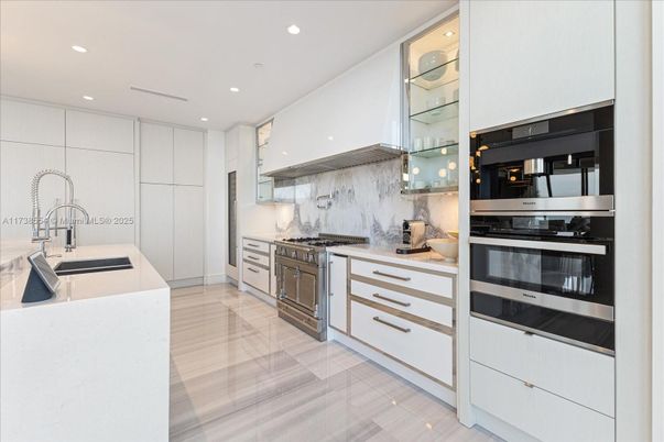Interior, Kitchen, Marble Walls, Recessed Lighting, Stainless Steel Appliances