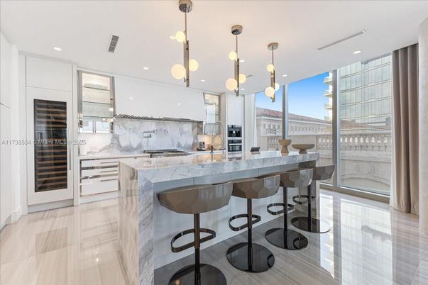 Interior, Kitchen, Marble Walls, Pendant Lights, Recessed Lighting, Stainless Steel Appliances