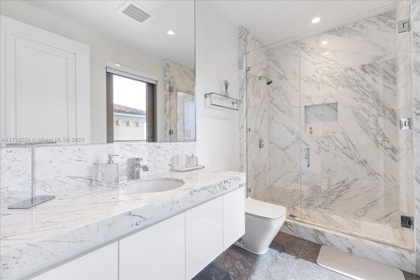 Bathroom, Dual Sink Vanities, Glass Shower, Interior, Marble, Marble Walls, Recessed Lighting