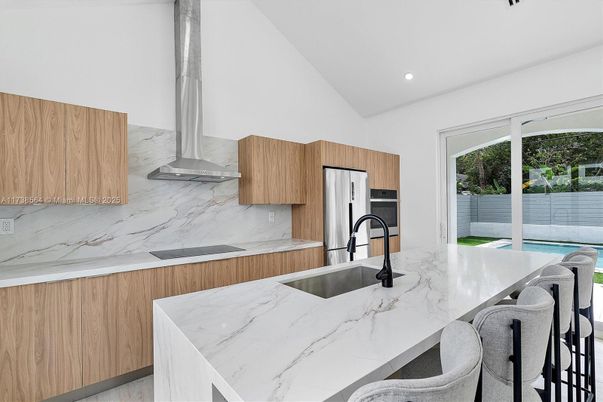 Interior, Kitchen, Marble Walls, Recessed Lighting, Stainless Steel Appliances
