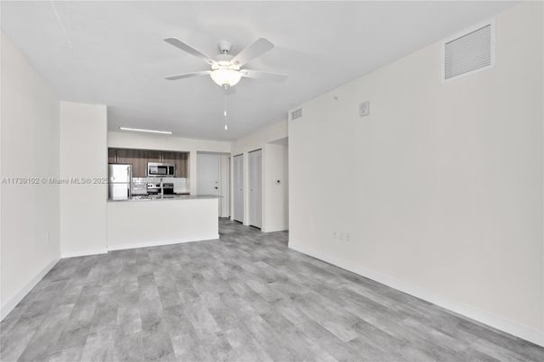 Empty room, Interior, Kitchen, Stainless Steel Appliances, Wood Texture Flooring
