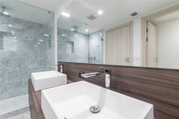 Bathroom, Dual Sink Vanities, Glass Shower, Interior, Marble, Marble Walls, Recessed Lighting