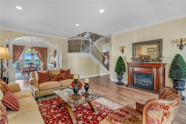 Chandelier, Dining room, Fireplace, Interior, Living room, Recessed Lighting, Wood Texture Flooring