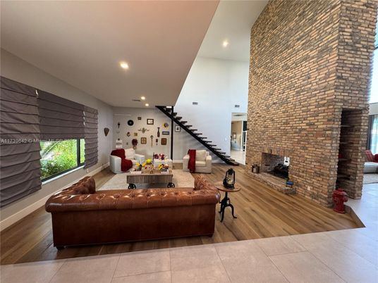 Fireplace, Interior, Living room, Recessed Lighting, Stone Walls, Wood Texture Flooring