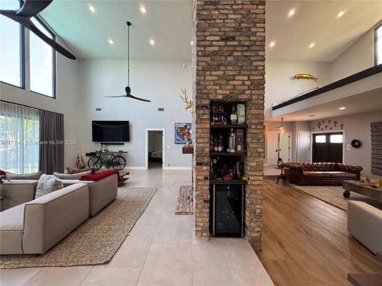 Fireplace, Interior, Living room, Recessed Lighting, Stone Walls, Wood Texture Flooring