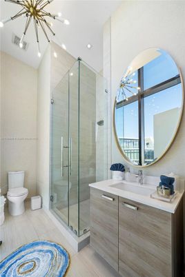 Bathroom, Glass Shower, Interior, Pendant Lights, Recessed Lighting, Wood Texture Flooring
