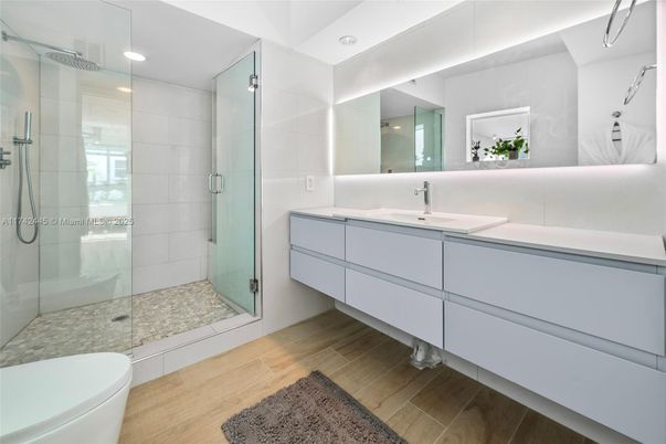 Bathroom, Dual Sink Vanities, Glass Shower, Interior, Recessed Lighting, Wood Texture Flooring