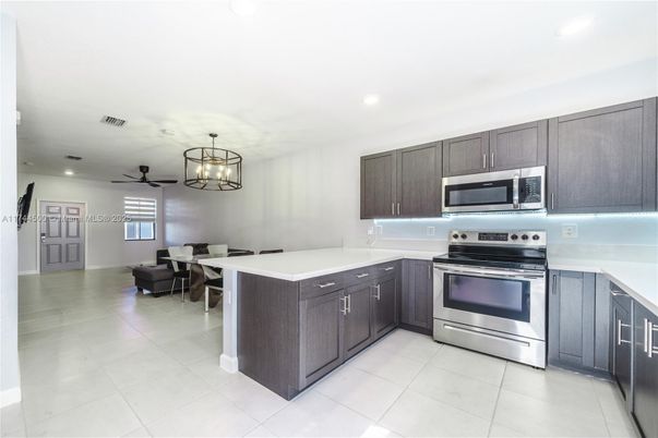 Chandelier, Dining room, Interior, Kitchen, Pendant Lights, Recessed Lighting, Stainless Steel Appliances