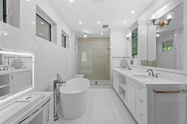 Bathroom, Dual Sink Vanities, Free Standing Baths, Glass Shower, Interior, Marble Walls, Recessed Lighting
