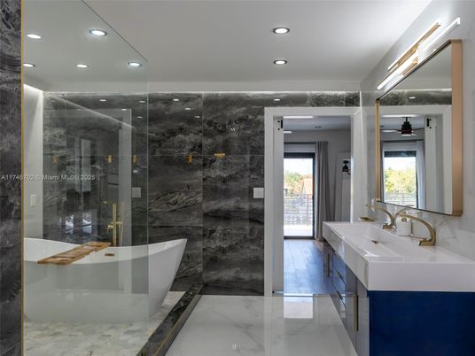 Bathroom, Dual Sink Vanities, Free Standing Baths, Glass Shower, Interior, Marble, Marble Walls, Recessed Lighting