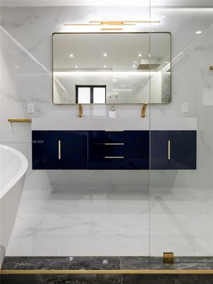 Bathroom, Dual Sink Vanities, Free Standing Baths, Glass Shower, Interior, Marble, Marble Walls, Recessed Lighting