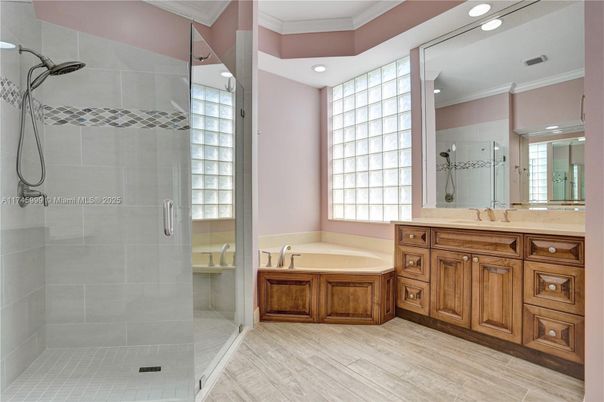 Bathroom, Dual Sink Vanities, Glass Shower, Interior, Recessed Lighting, Wood Texture Flooring