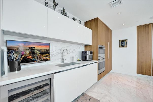 Interior, Kitchen, Marble, Marble Walls, Recessed Lighting, Stainless Steel Appliances