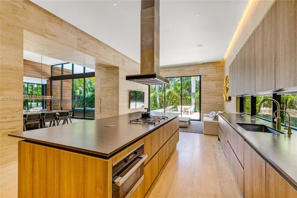 Dining room, Interior, Kitchen, Living room, Recessed Lighting, Stainless Steel Appliances, Wood Texture Flooring, Wooden Walls