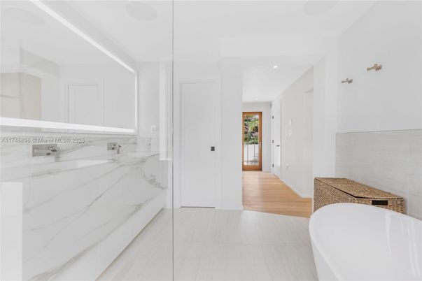 Bathroom, Free Standing Baths, Interior, Marble, Marble Walls, Recessed Lighting, Wood Texture Flooring