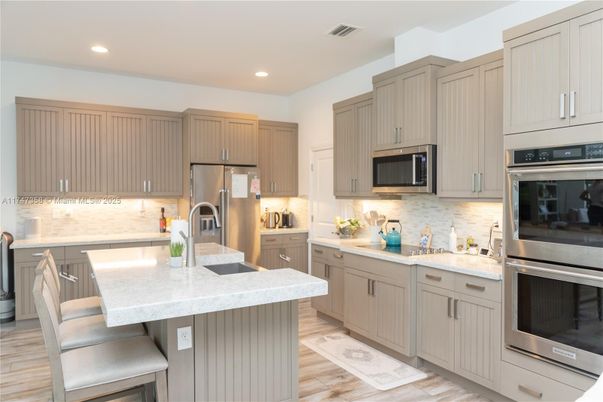 Interior, Kitchen, Recessed Lighting, Stainless Steel Appliances, Wood Texture Flooring