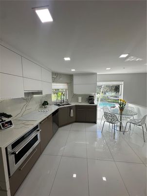 Dining room, Interior, Kitchen, Marble Walls, Recessed Lighting, Stainless Steel Appliances