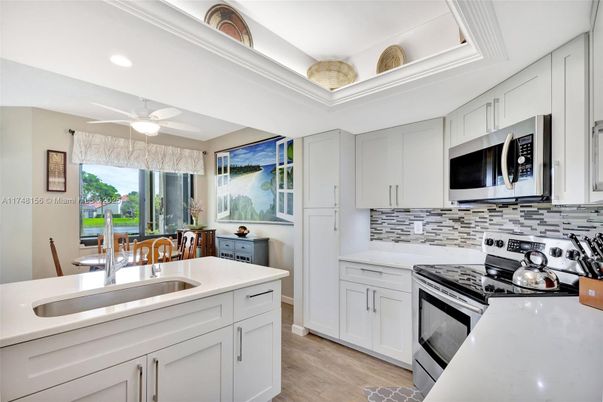 Dining room, Interior, Kitchen, Recessed Lighting, Stainless Steel Appliances, Wood Texture Flooring