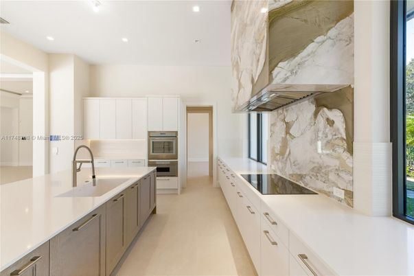 Interior, Kitchen, Marble Walls, Recessed Lighting, Stainless Steel Appliances