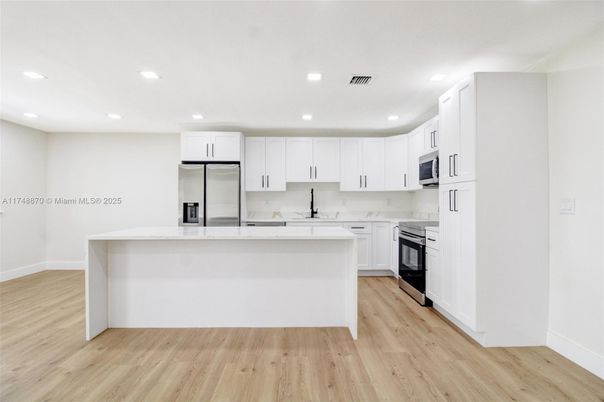 Interior, Kitchen, Recessed Lighting, Stainless Steel Appliances, Wood Texture Flooring