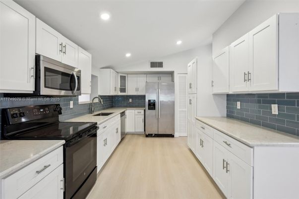Interior, Kitchen, Recessed Lighting, Stainless Steel Appliances, Wood Texture Flooring