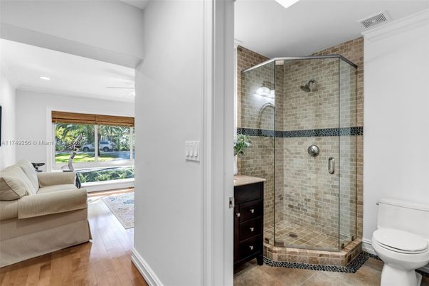 Bathroom, Glass Shower, Interior, Recessed Lighting, Stone Walls, Wood Texture Flooring