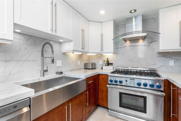 Interior, Kitchen, Marble Walls, Recessed Lighting, Stainless Steel Appliances