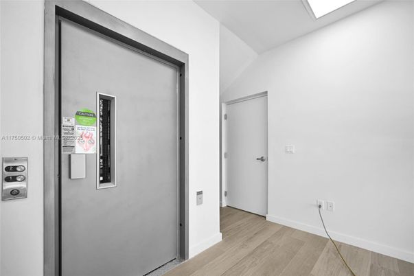 Elevator, Interior, Recessed Lighting, Wood Texture Flooring