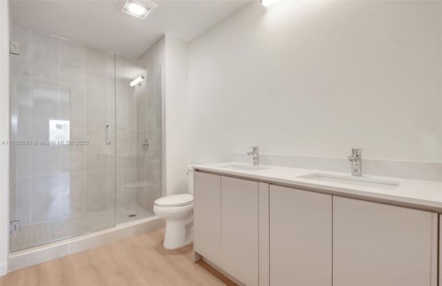 Bathroom, Dual Sink Vanities, Glass Shower, Interior, Wood Texture Flooring