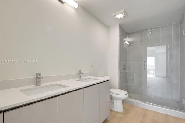 Bathroom, Dual Sink Vanities, Glass Shower, Interior, Wood Texture Flooring