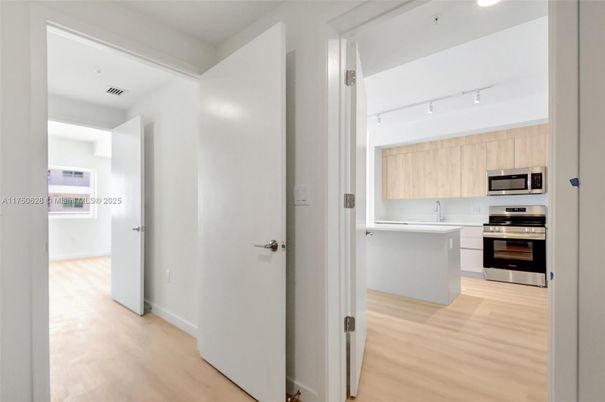 Interior, Kitchen, Recessed Lighting, Stainless Steel Appliances, Wood Texture Flooring