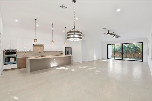 Interior, Kitchen, Marble Walls, Pendant Lights, Recessed Lighting, Stainless Steel Appliances