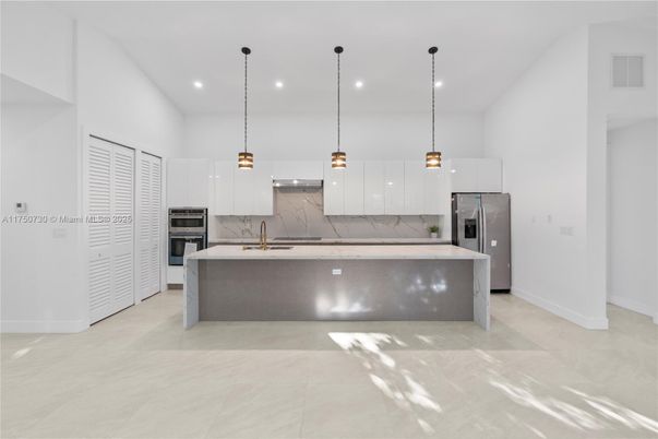 Interior, Kitchen, Marble Walls, Pendant Lights, Recessed Lighting, Stainless Steel Appliances